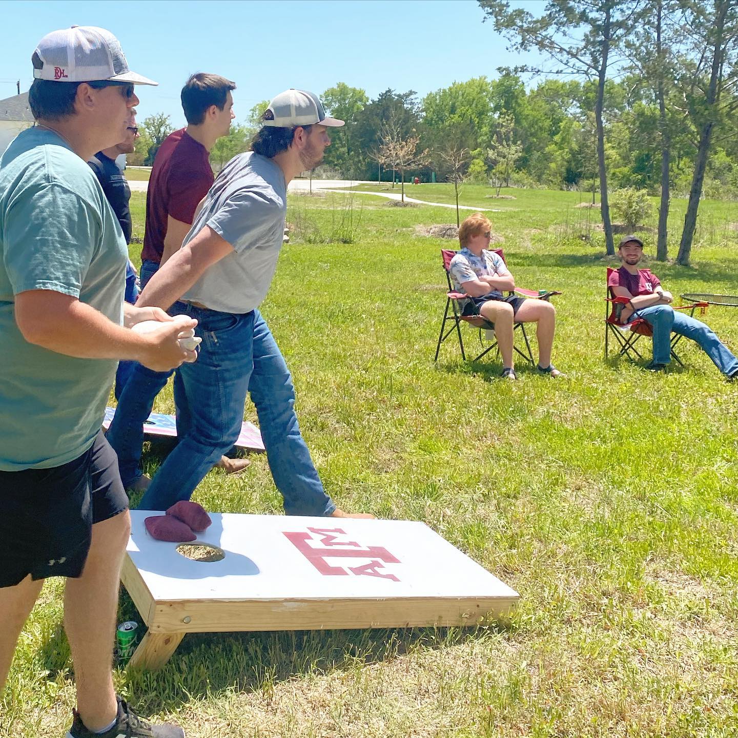 Students playing cornhole