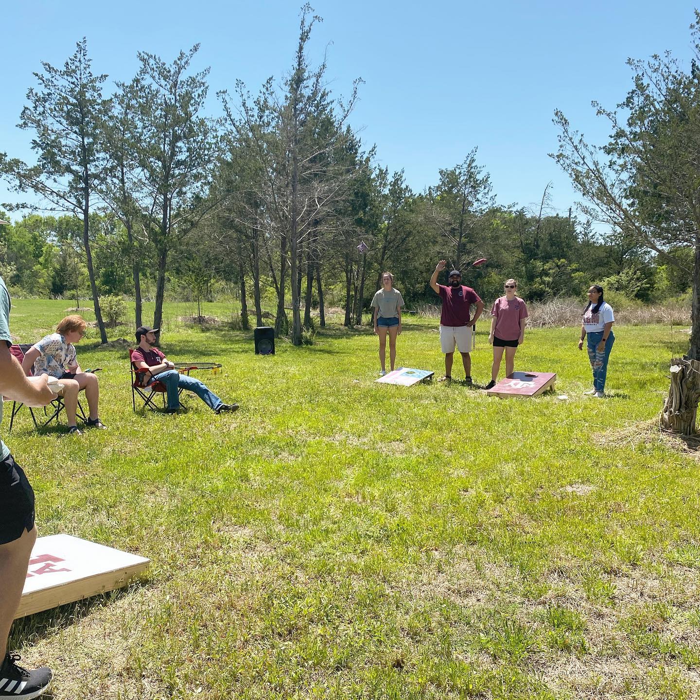 Students playing cornhole